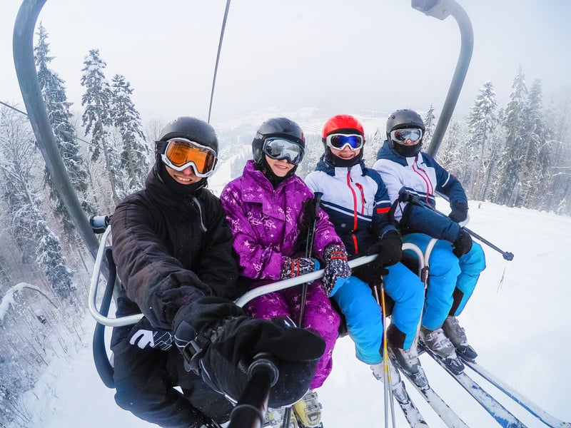 Four friends skiing, friends skiing in the mountains